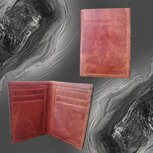 A luxury Handmade Vertical Vintage Leather Wallet by SECOLO in cognac tan, showing the slim upright profile and handcrafted interior card slots.